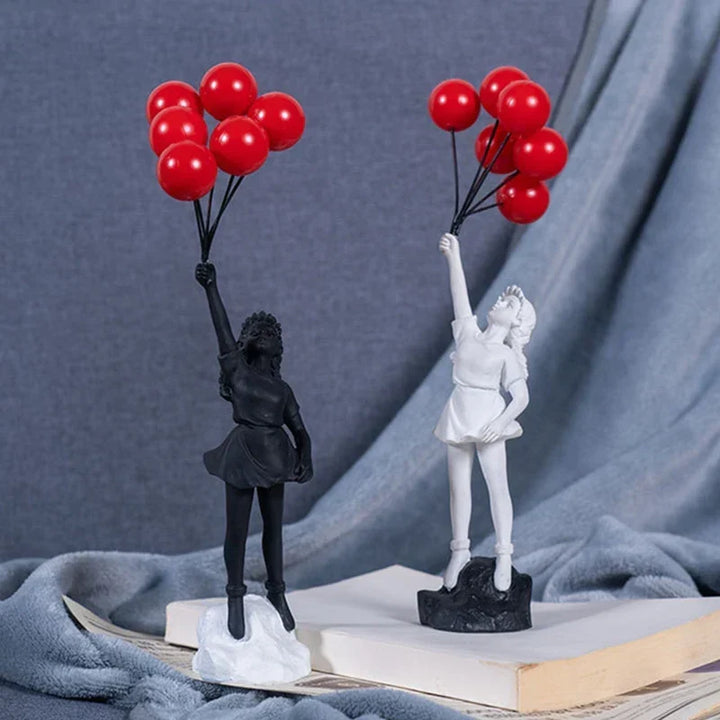 Skulptur af en pige med ballon i Banksy-stil til borddekoration og kreativ stueindretning