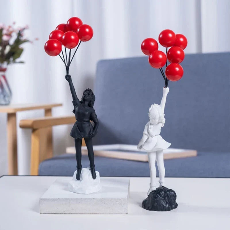 Skulptur af en pige med ballon i Banksy-stil til borddekoration og kreativ stueindretning