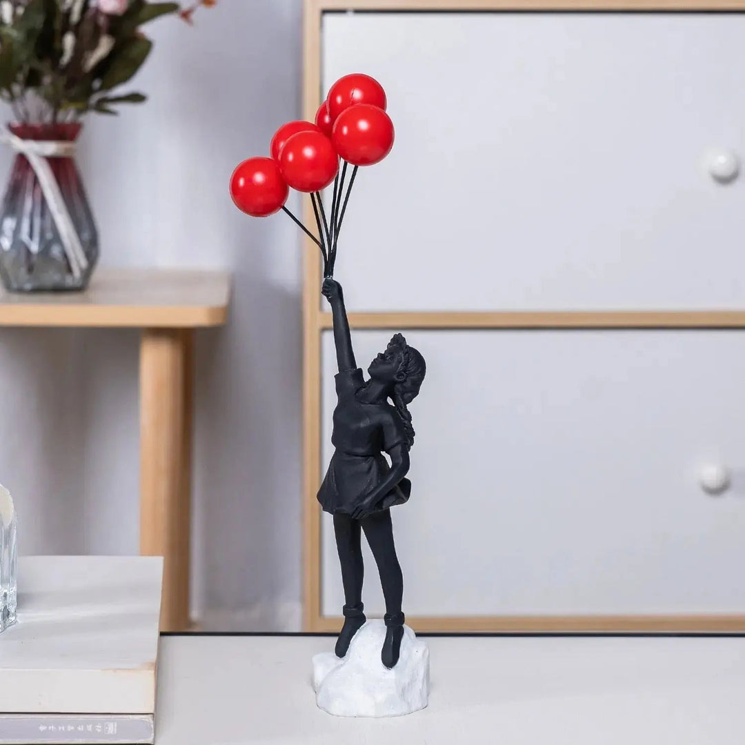 Banksy flyvende Ballonpige Statue