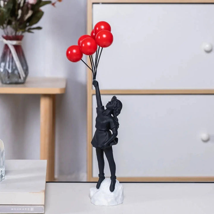 Banksy flyvende Ballonpige Statue