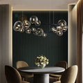 Moderne Kreativ Metal Kranse Belysning: 7/10 Klare Glasbobler, Lang Rund Design med G9 Lyskilde
