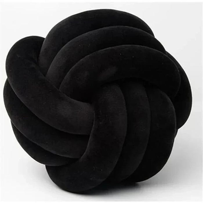 Dekorativ, blød pude med knyttet bold i suede look
