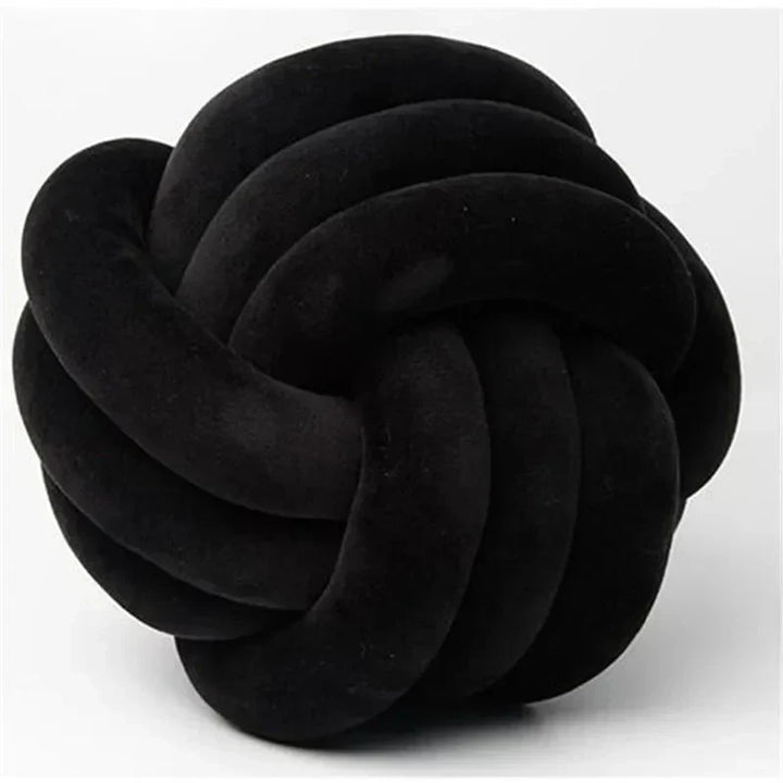 Dekorativ, blød pude med knyttet bold i suede look