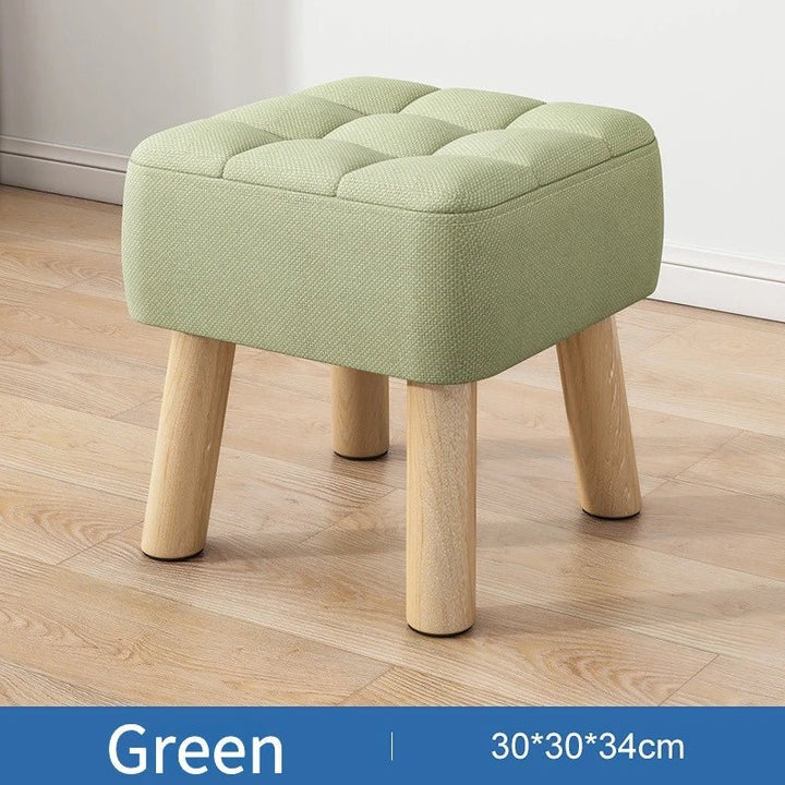 Polstret ottoman skammel i retro stil i pastelfarver
