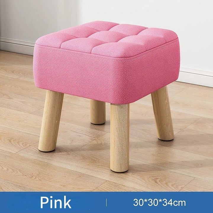 Polstret ottoman skammel i retro stil i pastelfarver