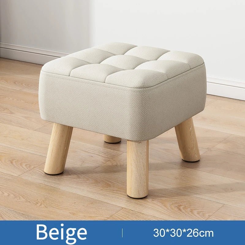 Polstret ottoman skammel i retro stil i pastelfarver