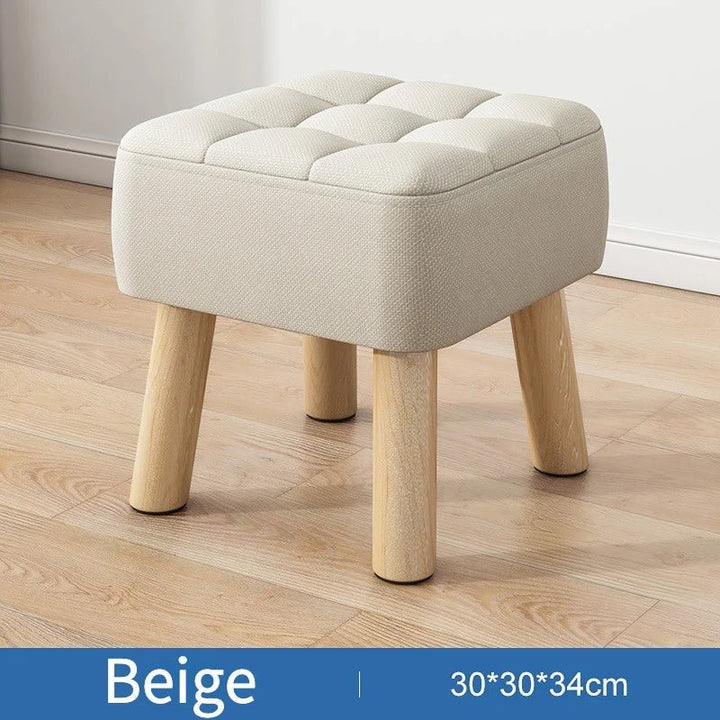 Polstret ottoman skammel i retro stil i pastelfarver