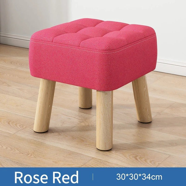 Polstret ottoman skammel i retro stil i pastelfarver