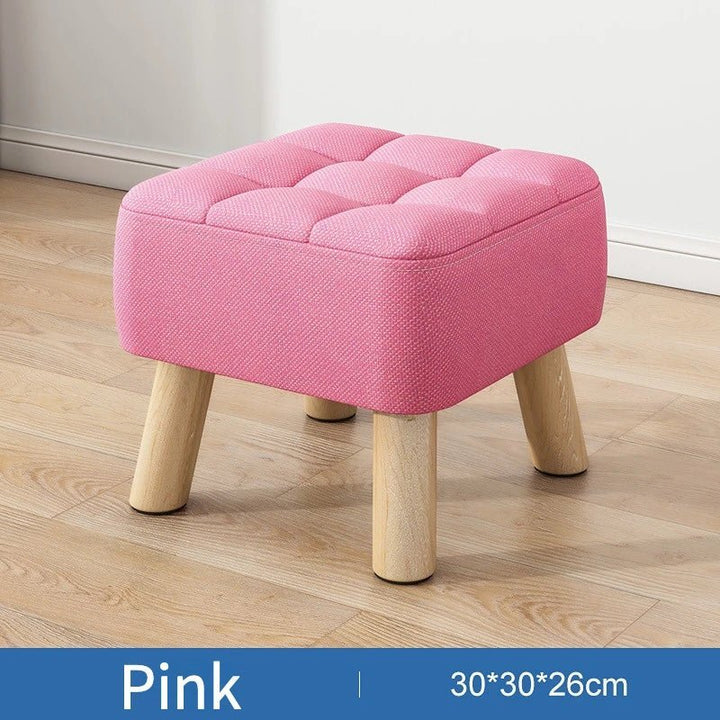 Polstret ottoman skammel i retro stil i pastelfarver