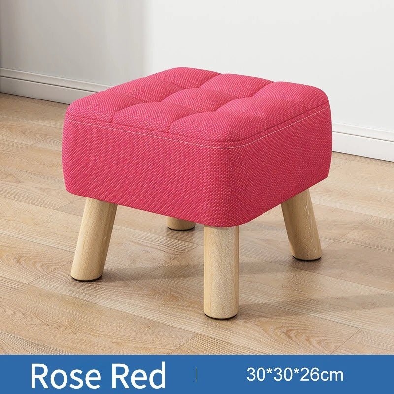 Polstret ottoman skammel i retro stil i pastelfarver