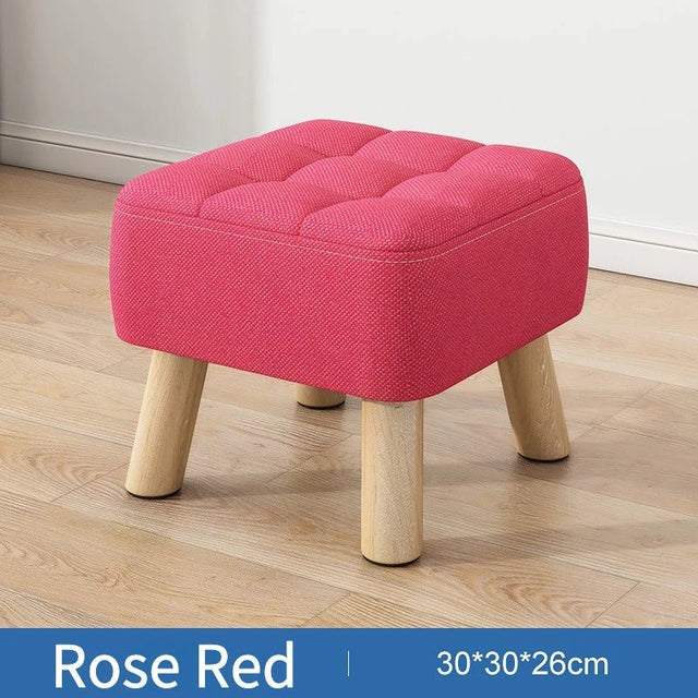 Polstret ottoman skammel i retro stil i pastelfarver