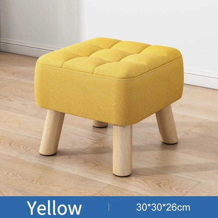 Polstret ottoman skammel i retro stil i pastelfarver