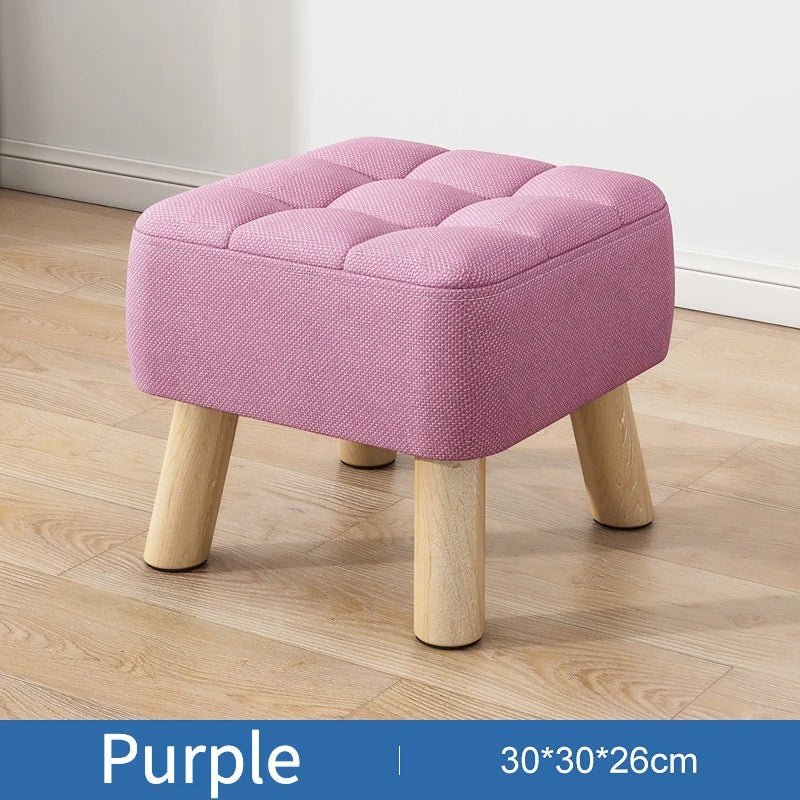 Polstret ottoman skammel i retro stil i pastelfarver
