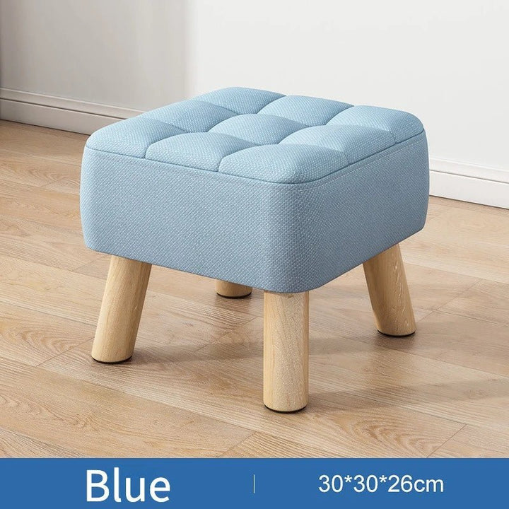 Polstret ottoman skammel i retro stil i pastelfarver