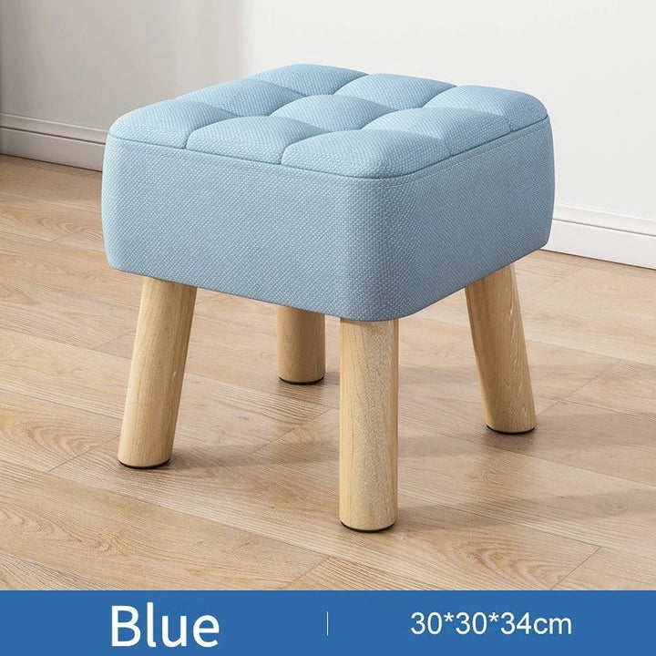 Polstret ottoman skammel i retro stil i pastelfarver